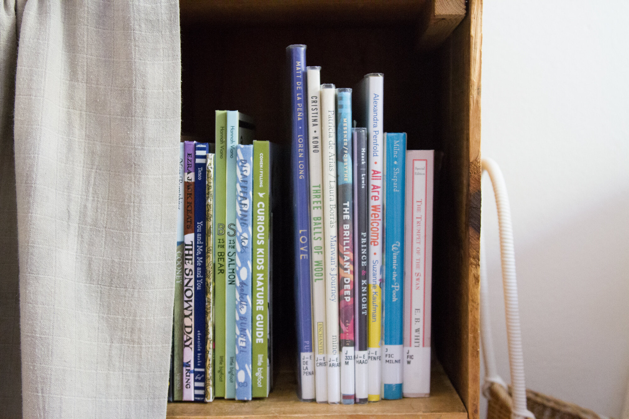 in a small space, cover a bookshelf with a curtain | reading my tea leaves