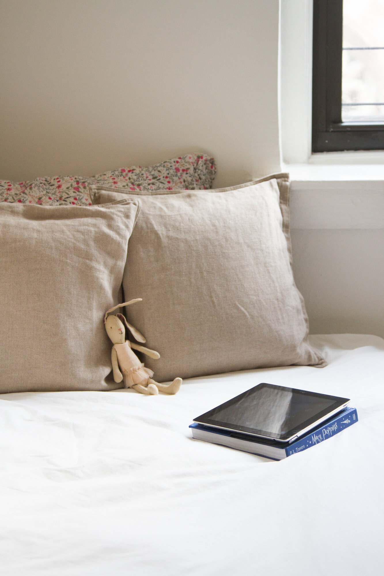 ipad on a bed with a small bunny | screen time | reading my tea leaves