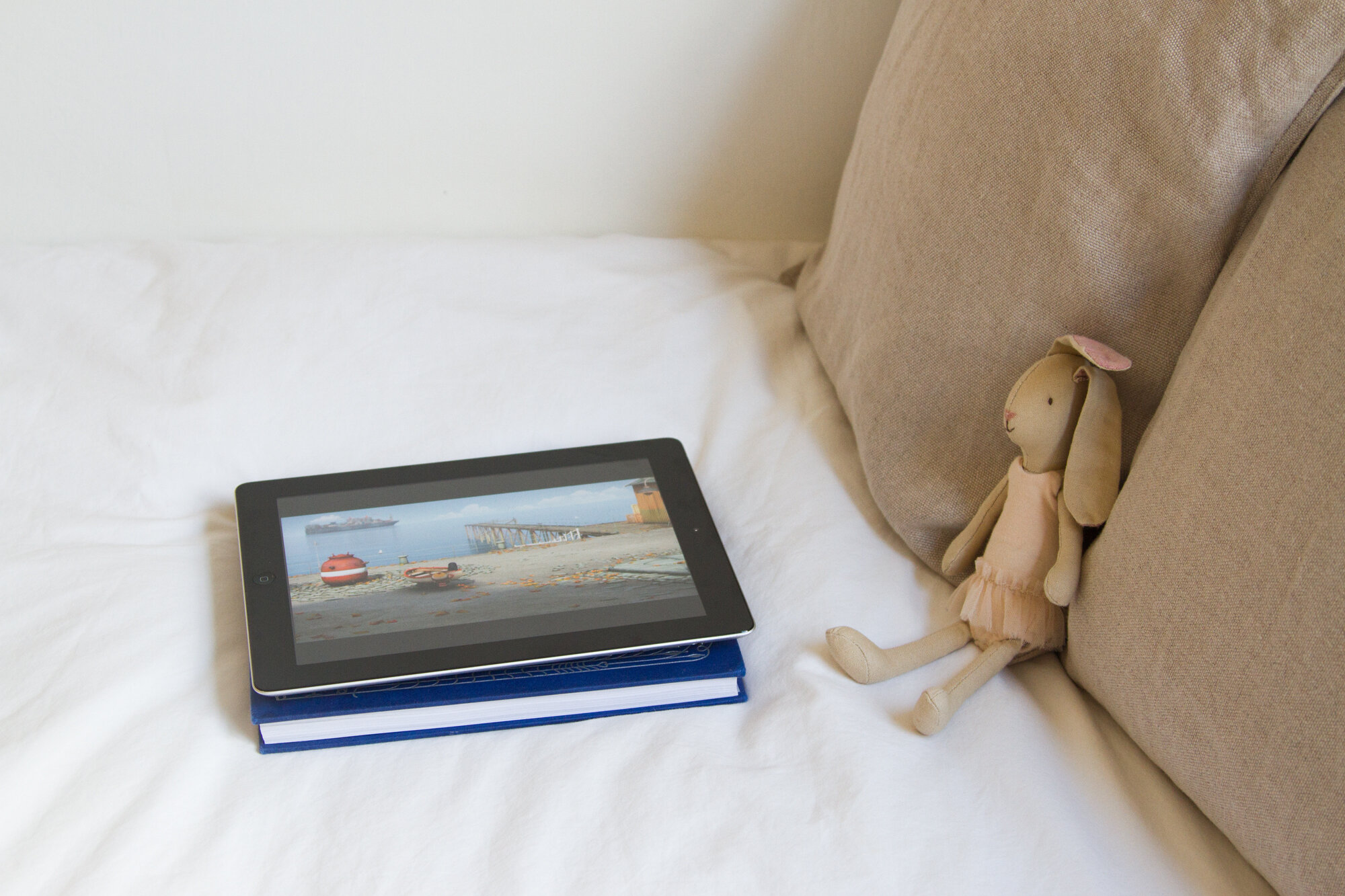 ipad on a bed with a small bunny | screen time | reading my tea leaves